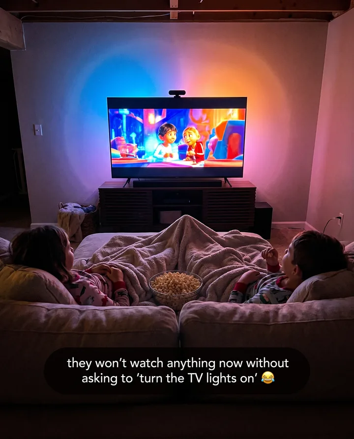 Spec ad for Govee styled as a parent’s story. Two kids under a blanket watch a cartoon while the TV backlight glows around the screen, with the caption: they won’t watch anything now without asking to turn the TV lights on.