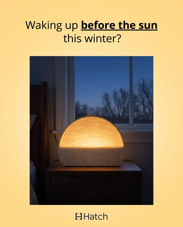 Spec ad for Hatch on a warm yellow background asking: Waking up before the sun this winter? Below it, a Restore 3 glows like a sunrise on a nightstand in a dark bedroom.