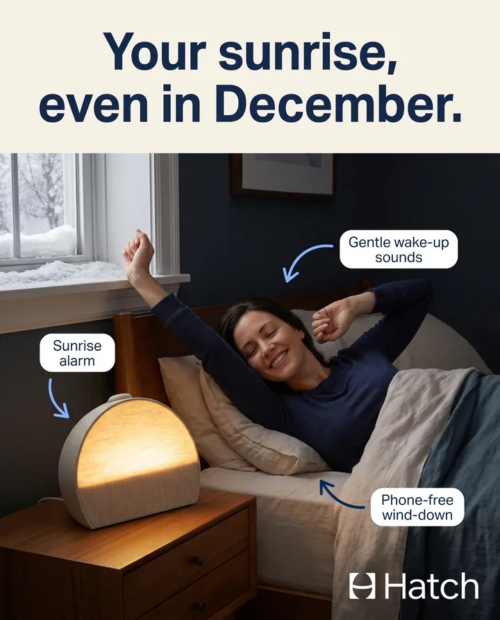 Spec ad for Hatch. A woman stretches awake in a dark winter bedroom as a Restore 3 glows beside her, under the headline: Your sunrise, even in December.